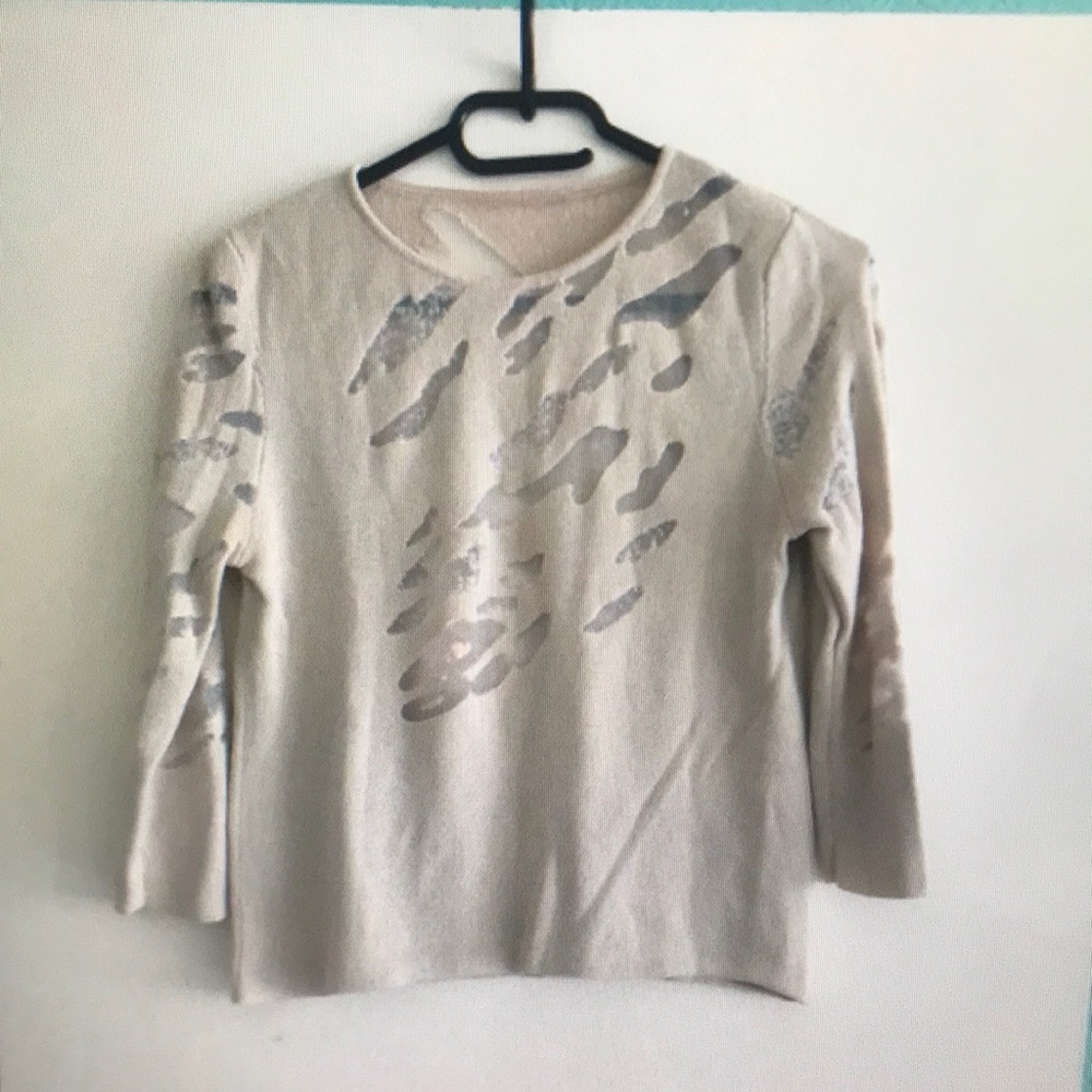 Elegant Cream Sweater with Silver Accents